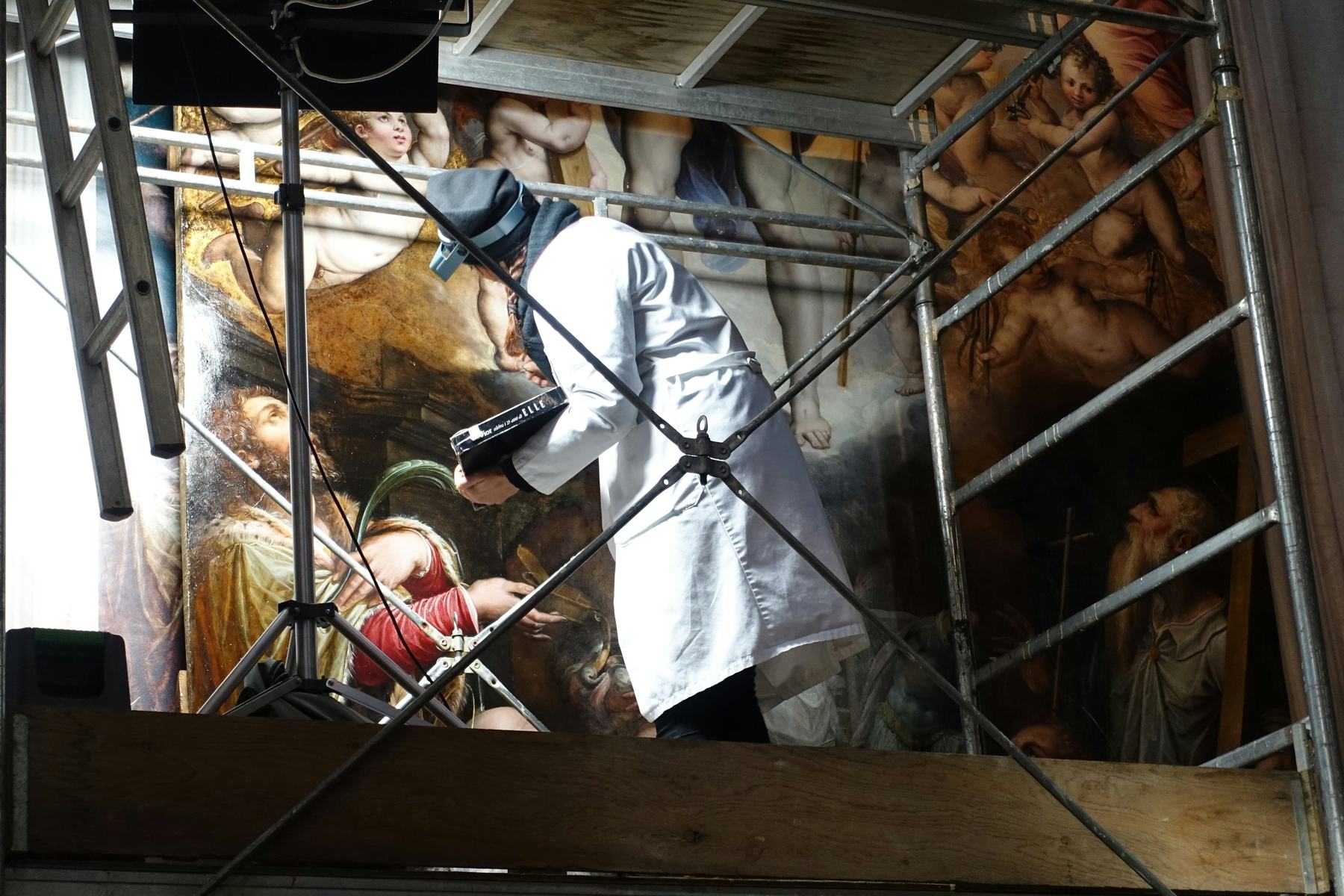 technician restoring a painting