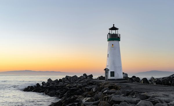 lighthouse with sea in the background
